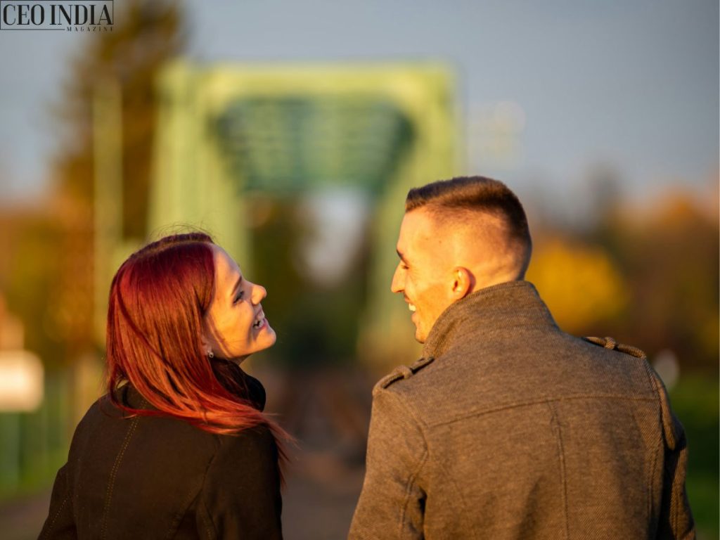 a couple looking at each other and laughing
